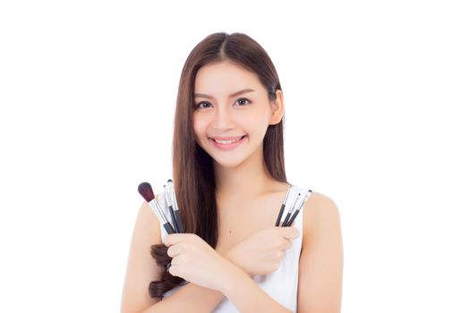 Beauty asian woman applying make up with brush on hand isolated on white background, beautiful of girl holding blusher, skincare and cosmetic concept.