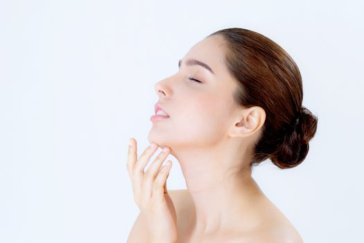 Portrait of beautiful asian brunette woman makeup of cosmetic, girl hand touch chin and smile attractive, face of beauty perfect with wellness isolated on white background with skin healthcare concept.
