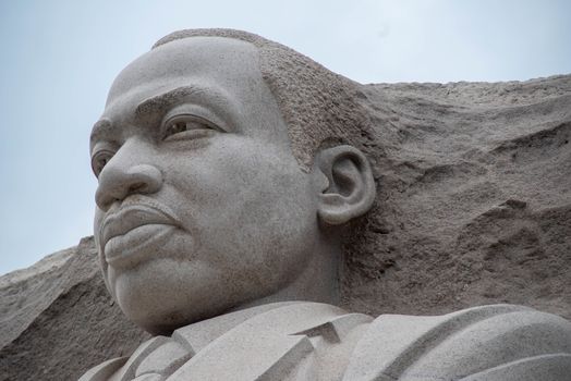Closeup of the pink granite monument to the great Dr. Martin Luther King. Pale blue sky. Editorial use.