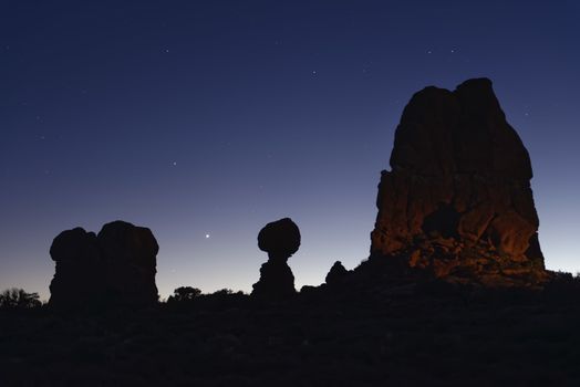 Balanced Rock under the stars and clear blue night sky, Arches National Park, Utah.