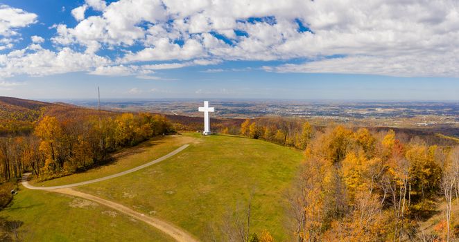 Aerial drone view of the metal structure of the Great Cross of Christ on Dunbar's Knob in Jumonville, PA