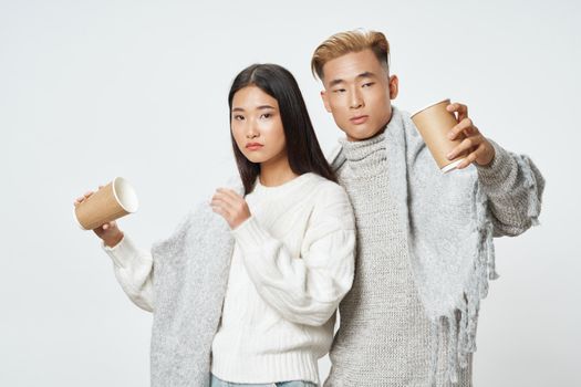 Asian woman and cup of coffee young man family