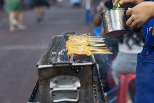 Pork Satay roast on the stove heat thai street food Bangkok Thailand
