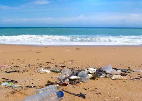 Plastic bottle waste is an environmental pollution on the beach.