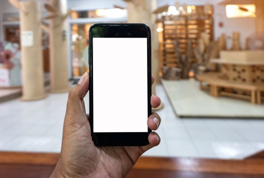 Asian man using hand hold black smartphone, Smartphone mockup background.