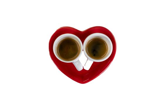 composition of cups with coffee and red saucer on a white background