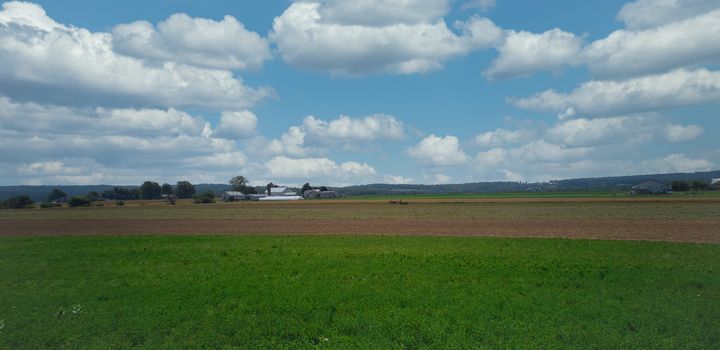 Steam Passenger Train Traveling Thru Countryside from Train Passenger View