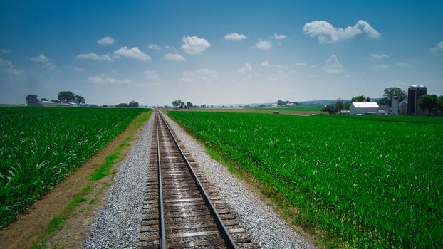 Old Rail Road Track going Thru Countryside on a Sunny Day