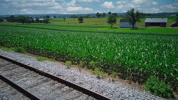Steam Passenger Train Traveling Thru Countryside from Train Passenger View