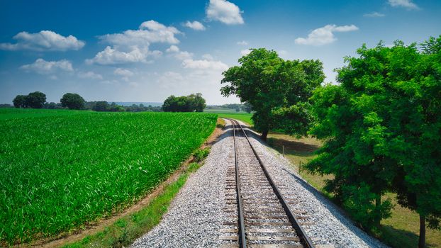 Old Rail Road Track going Thru Countryside on a Sunny Day