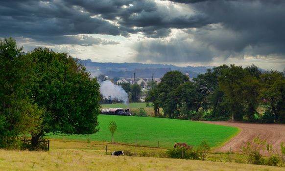 Antique Steam Passenger Train Puffing along Amish Countryside thru the Green Fields