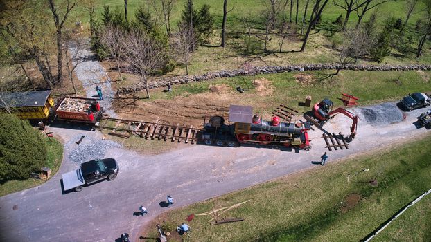 Aerial View of a Replica of an Old 1860's Steam Engine Being Assembled onto the Tracks Ready on a Sunny Spring Day