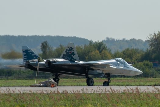 August 30, 2019. Zhukovsky, Russia. fifth-generation promising Russian multi-functional fighter Sukhoi Su-57 with a released parachute at the International Aviation and Space Salon MAKS 2019.