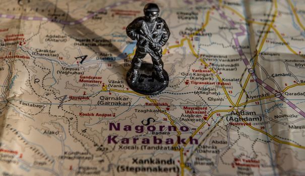 A figurine of an armed soldier on the map of Nagorno-Karabakh.
