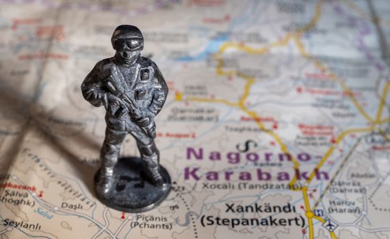 A figurine of an armed soldier on the map of Nagorno-Karabakh.
