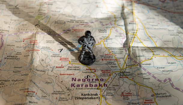 A figurine of an armed soldier on the map of Nagorno-Karabakh.