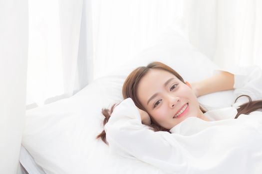 Beautiful asian young woman sleeping lying in bed with head on pillow comfortable and happy. girl with relax for health concept.