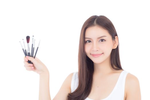 Beauty asian woman applying make up with brush on hand isolated on white background, beautiful of girl holding blusher, skincare and cosmetic concept.