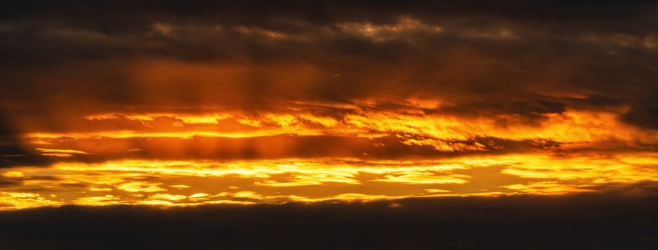 Panorama view of dramatic clouds rising of sun floating in sky to change summer weather. Soft focus, motion blur sky amazing meteorology cloud scape photography.