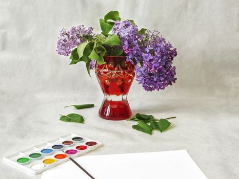 Lilac flowers in a red vase and watercolor paint