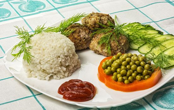 Food. Meat cutlet with boiled rice and vegetables