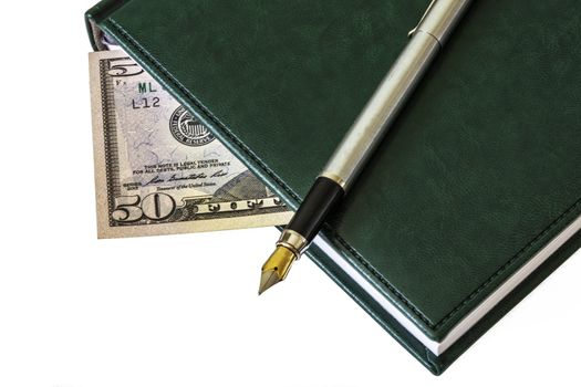 On the diary is a fountain pen. Between the sheets you see a bill of $ 50