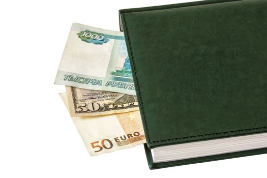 Between the sheets of the closed diary are visible parts of $ 50, 50 euros and 1000 Russian rubles