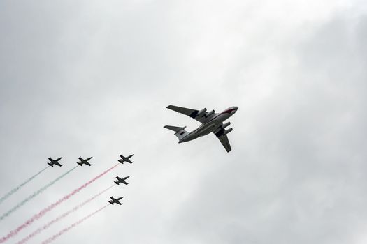 Belarus, Minsk - 03.07.2017: Military transport aircraft IL-76, accompanied by training and combat aircraft L-39 on the parade in honor of the Independence Day