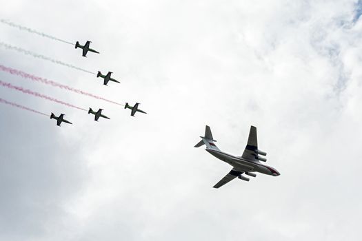 Belarus, Minsk - 03.07.2017: Military transport aircraft IL-76, accompanied by combat training aircraft L-39 at the parade in Independence Day
