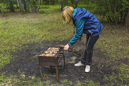 Preparation of juicy meat shish kebab on a spit