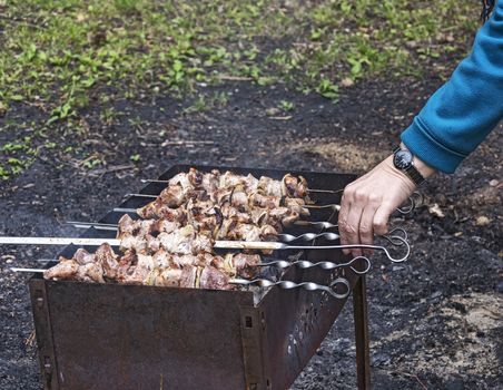 Preparation of meat fresh juicy kebabs on the grill