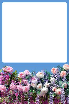 Greeting card. Decoration from many spring flowers at the bottom isolated and white blank space over for any text to white vertical view