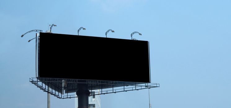 Blank billboard large size for outdoor or out of home advertising with blue sky.