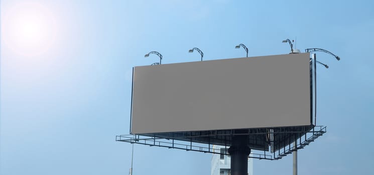 Blank billboard large size for outdoor or out of home advertising with blue sky.