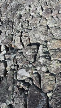 Texture of big real rock stone wall old and dirty on japan Himeji castle in sunny summer day.