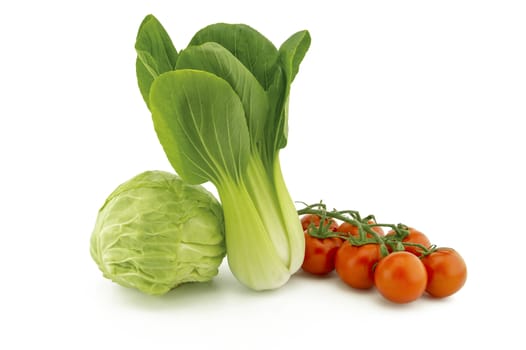 Chinese cabbage and white cabbage and cherry tomato twig isolated on white background
