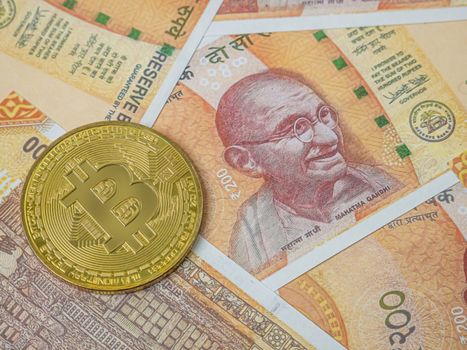 The India banknote and bit coin  for business content.
