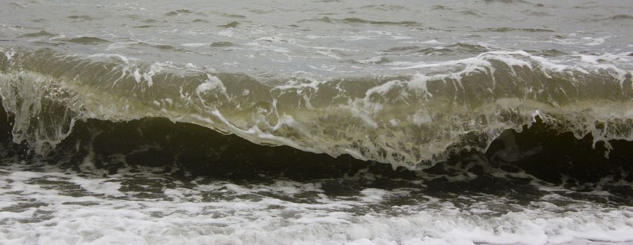 Stormy seascape, waves and wind in the black sea of Georgia. Drops ans splashes.