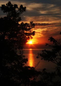 Beautiful sunset in Black sea of Georgia, Horizon and colorful sky. Orange and red colors.