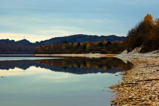 Shaori lake in Racha, Georgia. Lake landscape at autumn time.