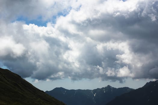 Mountain cloudscape and landscape in Georgia. Horizon in mountain range.