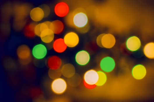Bokeh light vintage abstract backdrop. Defocused christmas glittering shine bulbs lights texture. Abstract noel festival sparkle circle phon.