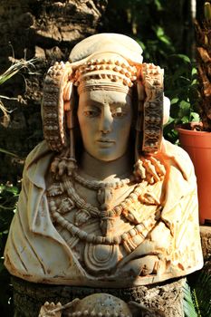 Lady of Elche bust in a garden