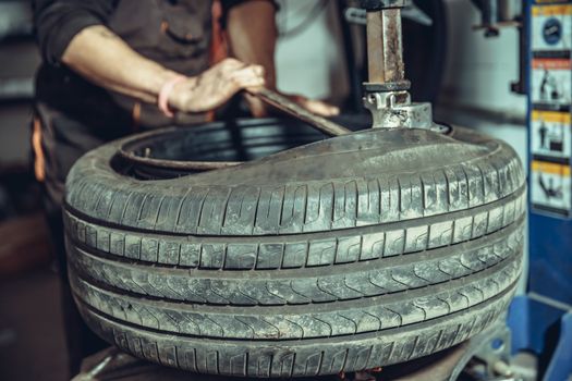 replacement of tires on car wheels.