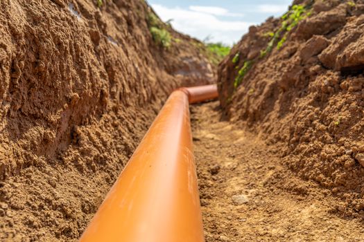 Plastic pipes in the ground during the construction of a building