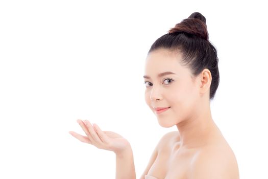 Asian of portrait beautiful young woman showing with healthy clean skin presenting something empty copy space on the hand isolated on white background, beauty concept.
