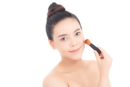 Beauty of portrait asian woman applying make up with brush of cheek isolated on white background, beautiful of girl holding blusher, skincare and cosmetic concept.