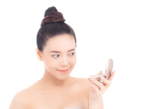 Portrait of beautiful asian woman applying powder puff at cheek makeup of cosmetic, beauty of girl with face smile isolated on white background, wellness and healthcare concept.