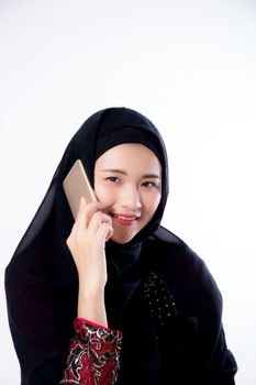 Beautiful of portrait muslim asian woman talking on mobile phone isolated on white background, girl with islam call telephone and smile, communication and religion concept.