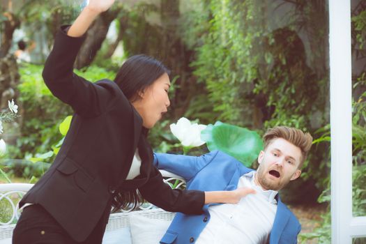 Business people argue in meeting and asian woman fighting man about mistake in work at office, businesswoman angry and blaming businessman with partner of bad, conflict concept